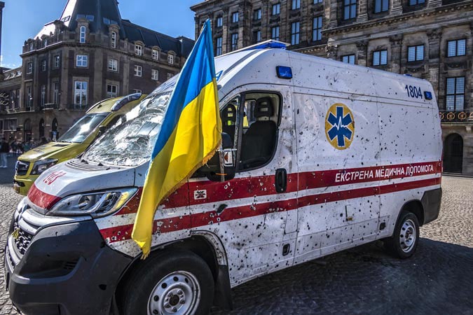 Amsterdam. Dam Square. Ambulance shot by Russian invaders.